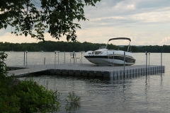 1000 Islands Docks Ltd. - Eastern Ontario - Residetial Floating Modular Dock Installation with Boat at Sunset Image